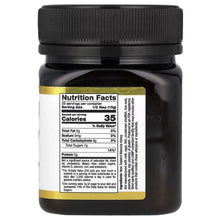 Manuka honey jar with nutrition facts panel, black lid and gold border