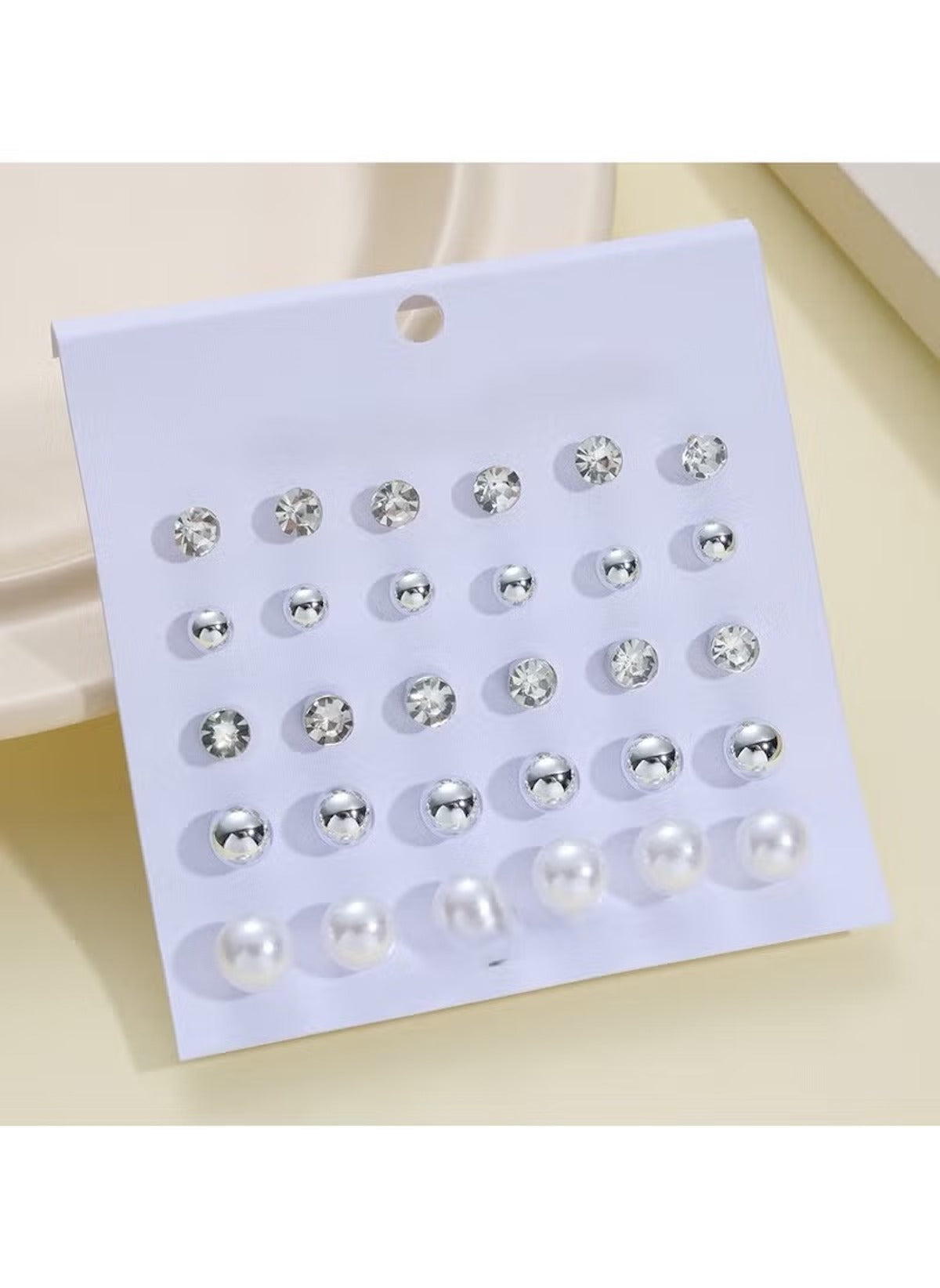 Mumzar 15 pair earring set UAE with silver studs and pearl designs on display card