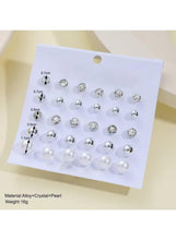 Earring set display card with crystal and pearl stud earrings, size markings visible