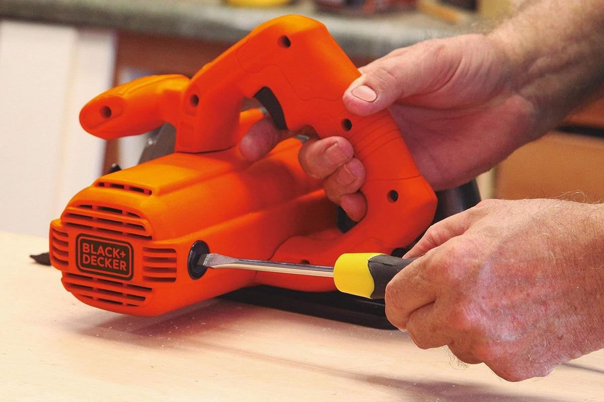 Black+Decker 1400W circular saw, orange body, exposed blade on wood