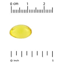 Vitamin D3 softgel beside 0–1 inch scale, yellow gel capsule
