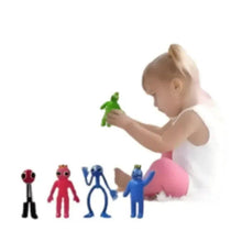 Set of colorful character collectible figures, including red, blue, and green figures