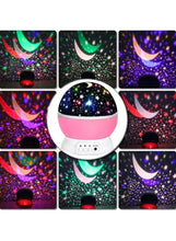 Romantic night light projector displaying multicolor star and moon patterns, front view
