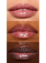 Shiny glitter lip oil on lips, showing three glossy swatches