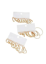Gold-tone hoop and cuff earring set, clustered on cards, multiple styles