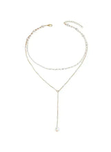 Layered pearl drop necklace with long pendant pearl on a thin adjustable chain
