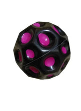 Rubber bounce ball with dark base and pink circular spots