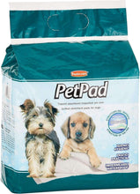 Green and white PetPad dog training pad package with dog and puppy graphics