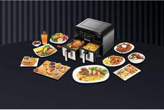 Dual-zone air fryer with multiple plated foods surrounding it