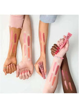 Coral liquid blush swatches on skin with tube