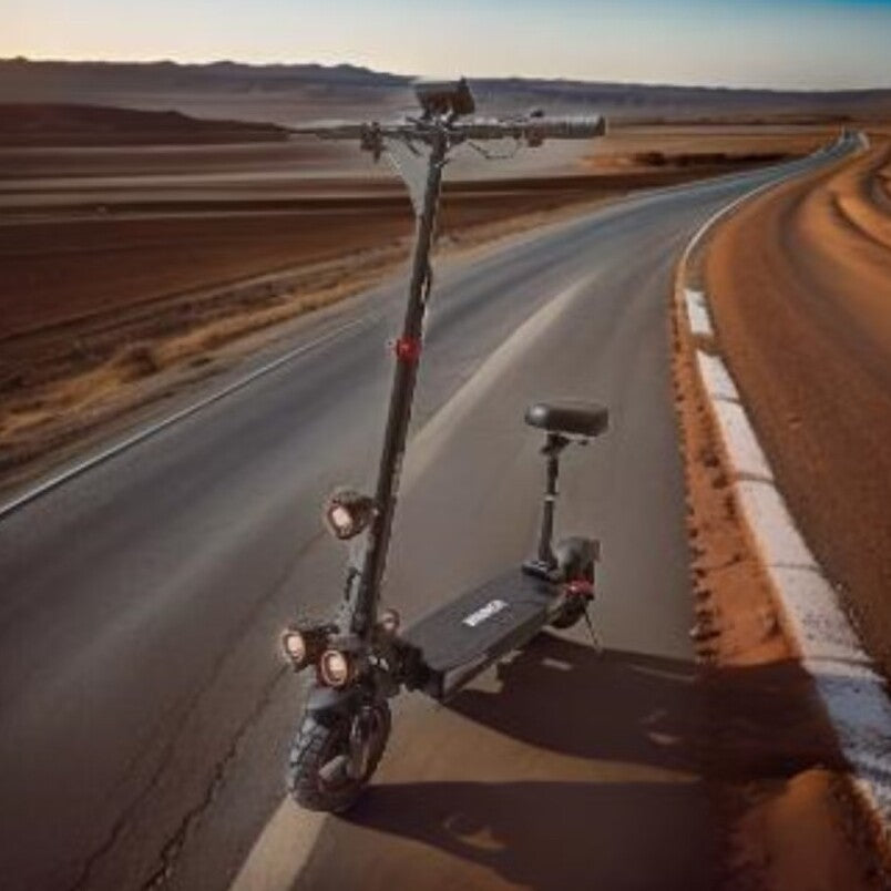 Winner 2000W folding electric scooter UAE with seat and off-road tires on desert road