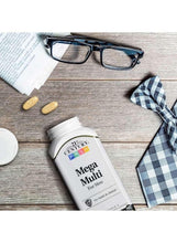 Mega Multi for Men multivitamin bottle with loose tablets on a tabletop