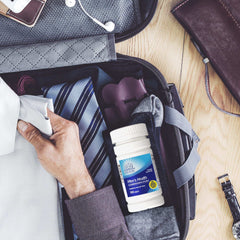 21st Century Men's Daily Multivitamin Tablets in a travel bag with clothing and accessories