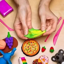 Kids hands crafting with colorful clay pieces and small shapes with pizza and animals