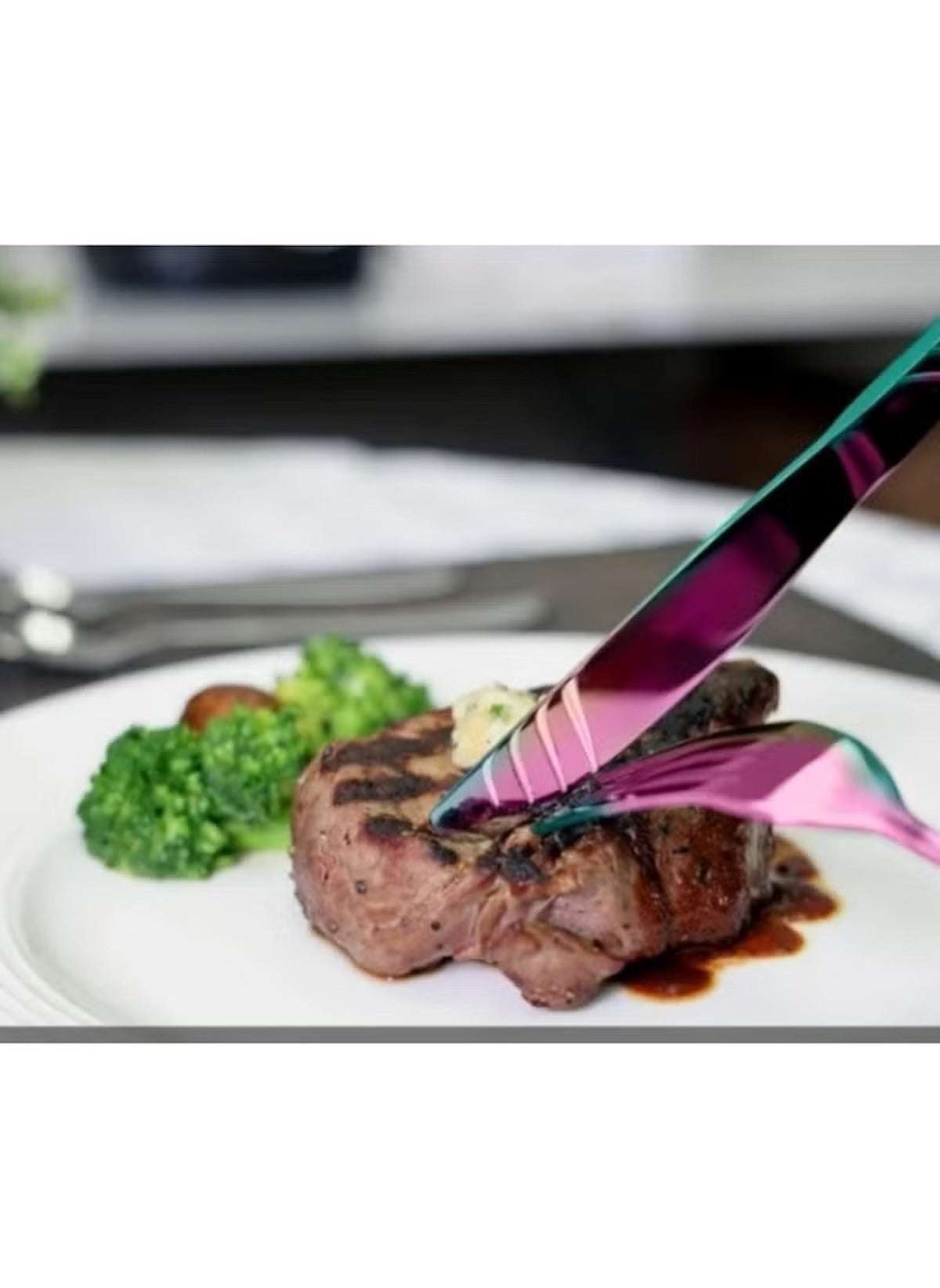 Huitich 24-piece dinnerware set with stand includes iridescent flatware cutting steak served with broccoli