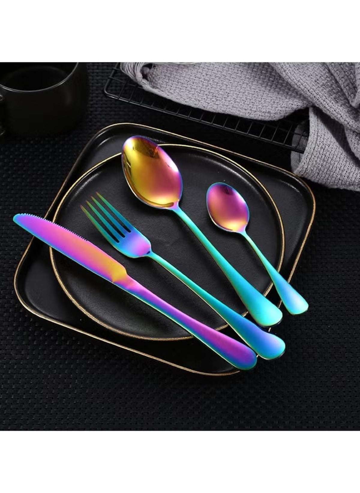 Huitich 24-piece dinnerware set with stand featuring iridescent flatware including knife, fork, and spoons on black plates