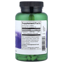 Swanson magnesium taurate supplement bottle with Supplement Facts panel and tablets