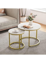 Two round nesting coffee tables with white marble-pattern tops and gold metal bases