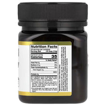 Manuka honey jar with black cap and Nutrition Facts label