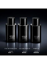 Three black fragrance bottles with metal caps, different Armani Code variants