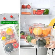 Clear fridge storage organizer bins with lids holding vegetables, shown on refrigerator shelf