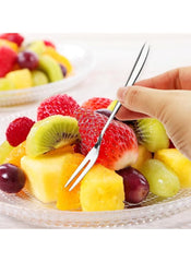Huitich 3-piece mini fork set for cakes used to pick fresh fruit from a glass plate