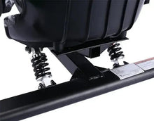 Black scooter rear suspension and motor housing near the deck