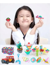 Water bead craft set with multicolor pieces and finished mini figures on a table