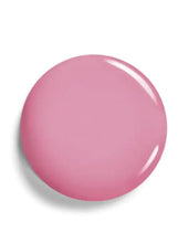 Pink liquid blush swatch circle on surface, luminous finish
