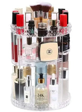 Clear rotating makeup organizer with stacked compartments and assorted cosmetics