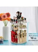 Rotating clear makeup organizer holding lip color bottles and makeup brushes