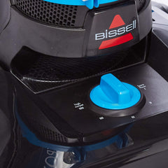Upright vacuum cleaner top with blue cap control and BISSELL logo