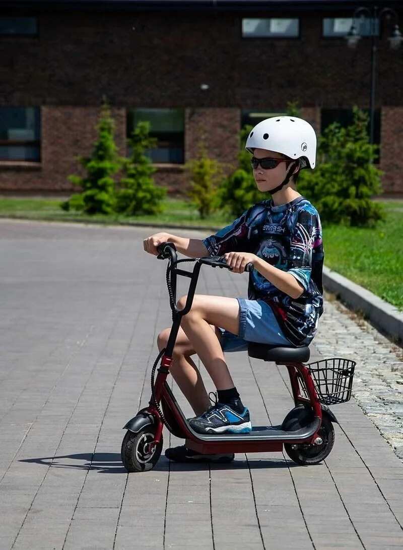 Winner sky 36V lithium kids scooter with black frame and basket ridden by child wearing helmet