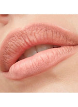 Mauve-pink lip liner on natural lips, close-up of the mouth