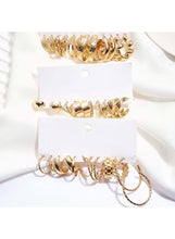 Gold-tone hoop earring set: assorted hoops on two stacked display cards
