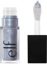 Glittery silver lip oil applicator in clear tube with black logo label