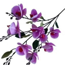Purple artificial orchid flower stems with dark branches and red centers