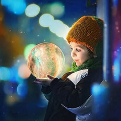 Child holding Home led 3d moon astronaut lights glowing as 3d galaxy moon lamp UAE in dark setting