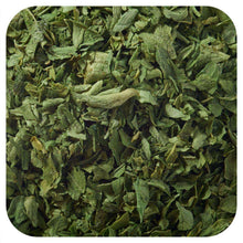 Dried parsley leaf flakes, green herb pieces in close-up