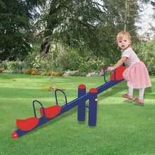Kids metal 4-seat seesaw in garden, blue frame with red seats and a standing toddler