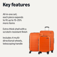 Orange hardside spinner luggage set with scratch-resistant shell, telescoping handle, wheels