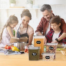 Clear plastic airtight food storage containers with snap lids on kitchen table