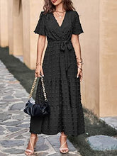 Black Swiss-dot maxi dress with V-neck wrap, short flutter sleeves and tie waist