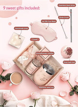 Rose spa gift set contents on tray: eye mask, candle, soap bar, towel and tools