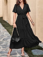 Black tiered wrap maxi dress with V-neck and tie waist, short flutter sleeves