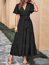 Black tiered A-line maxi dress with V-neck wrap, tie waist, flutter sleeves