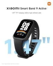 Black fitness tracker front angled view with lit display and side button holes