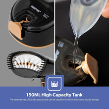 Handheld garment steamer showing water tank and steam jet nozzle, black with gold handle