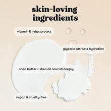 Creamy white lotion texture smear with small droplet highlights
