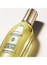 Skin oil bottle close-up showing AMANDE SUBLIME label and gold cap